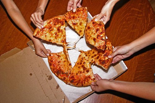 people grabbing slices of pizza, overhead view - food stock pictures, royalty-free photos & images