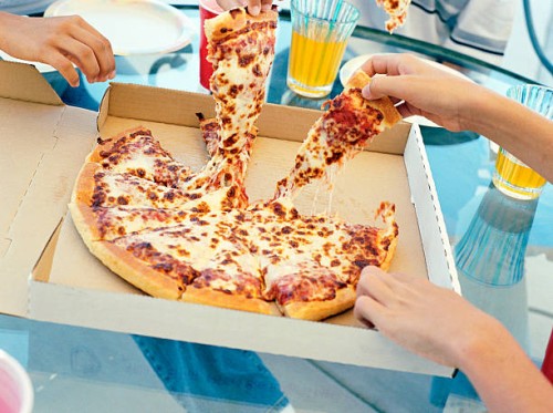 people sharing pizza - junk food stock pictures, royalty-free photos & images