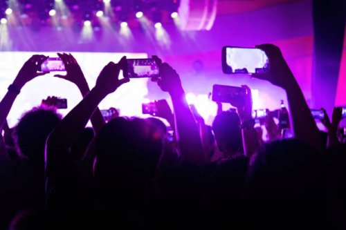 people taking picture at music festival - concert stock pictures, royalty-free photos & images