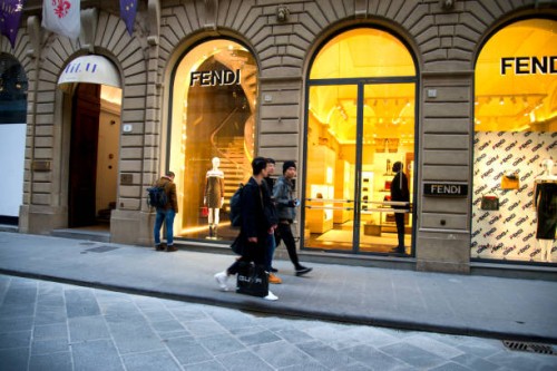people walking in front fendi window display in florence, tuscany, italy - fashion week stock pictures, royalty-free photos & images