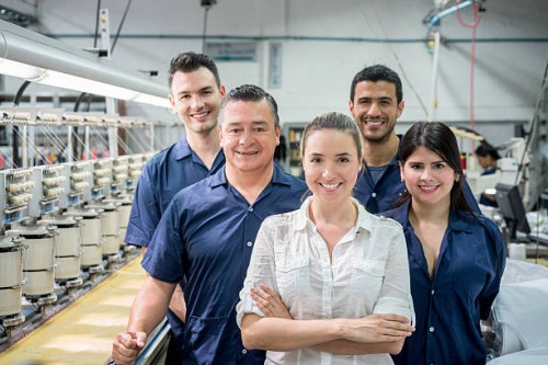 people working at an embroidery factory - fashion stock pictures, royalty-free photos & images