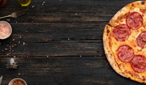 pepperoni pizza on wooden table - junk food stock pictures, royalty-free photos & images
