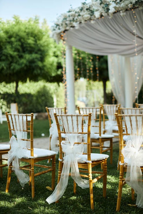 photo of beautiful backyard wedding act chair decorations. - garden decoration stock pictures, royalty-free photos & images