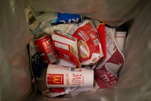 Photograph taken on November 19, 2015 shows fast food packaging inside a rubbish bin near Victoria Station in central London.