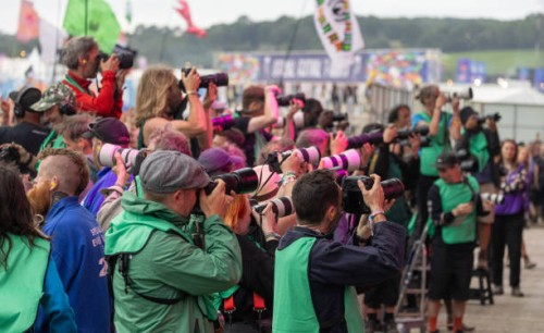 Photographers take photographs of a performance on the Other Stage during day five of Glastonbury Festival 2024 at Worthy Farm, Pilton on June 30,...