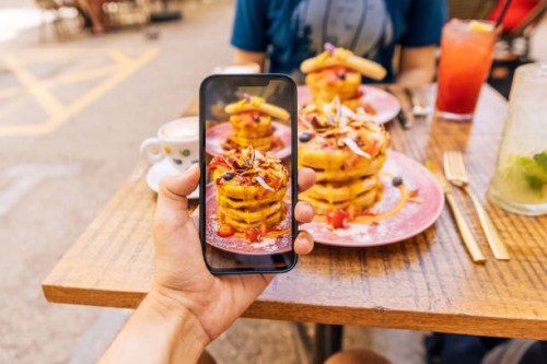 photographing brunch at the cafe with a smartphone, personal perspective view - food stock pictures, royalty-free photos & images