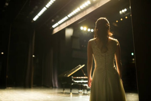 pianist walking toward to the stage - concert stock pictures, royalty-free photos & images