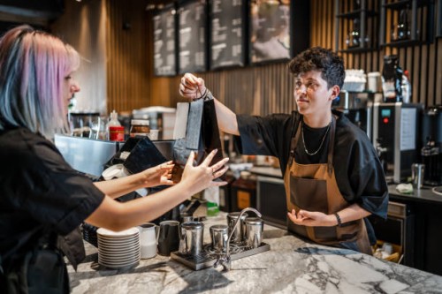 picking up curbside take out food in a cafe - junk food stock pictures, royalty-free photos & images