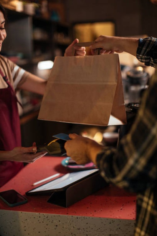 picking up food from a restaurant - junk food stock pictures, royalty-free photos & images