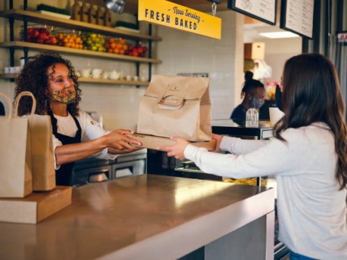 picking up take out food in a cafe - junk food stock pictures, royalty-free photos & images