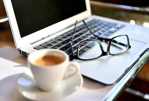 Picture taken on March 15, 2020 shows glasses on a laptop at a home office desk in Salzburg, Austria. / Austria OUT