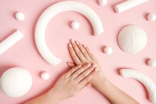 pink manicure and white abstract shapes on pink background, top view. - nails art stock pictures, royalty-free photos & images