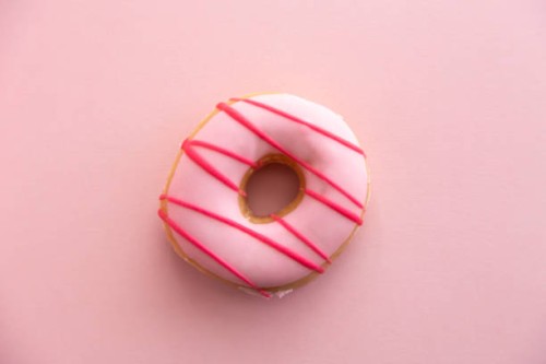 pink striped doughnut - junk food stock pictures, royalty-free photos & images