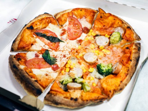 pizza margherita and capricciosa, half and half - junk food stock pictures, royalty-free photos & images