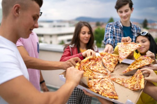 pizza time with friends - junk food stock pictures, royalty-free photos & images