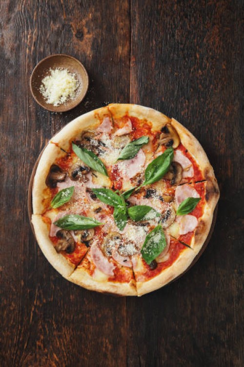 pizza with ham, mozzarella, mushrooms, herbs - junk food stock pictures, royalty-free photos & images