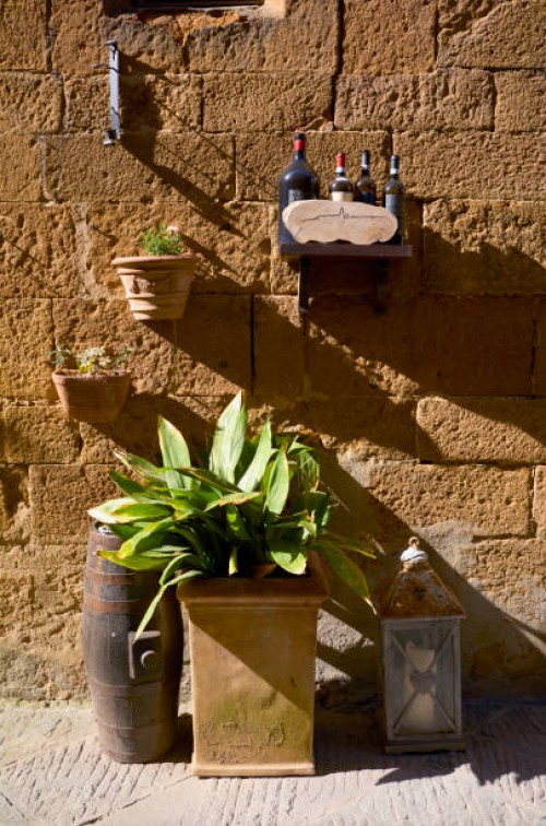 plant pots and hanging baskets in an old cobbled street - garden decoration stock pictures, royalty-free photos & images