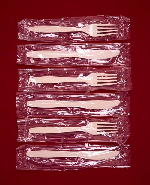 plastic knives and forks in wrappers - junk food stock pictures, royalty-free photos & images