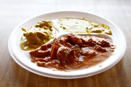 Platters of Indian foods, including Vegetable Curry and Butter Chicken, at Raja Sweets, a fast-food Indian restaurant that celebrated its 25th...