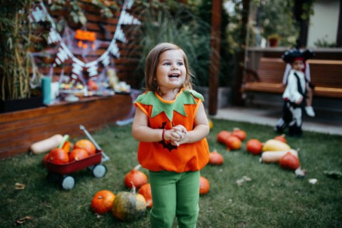 playful kids enjoying a halloween party - garden decoration stock pictures, royalty-free photos & images