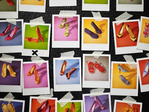 polaroids of shoes taped to wall - fashion stock-fotos und bilder