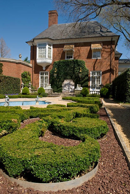 Pond and statutes decorate the French parterre at the Marjorie Merriweather Post mansion at the Hillwood Estate in Washington.