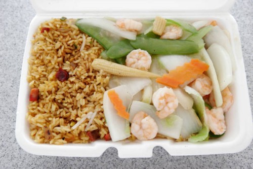 Pork fried rice in a take out container from Fortune Cookies Chinese Restaurant.