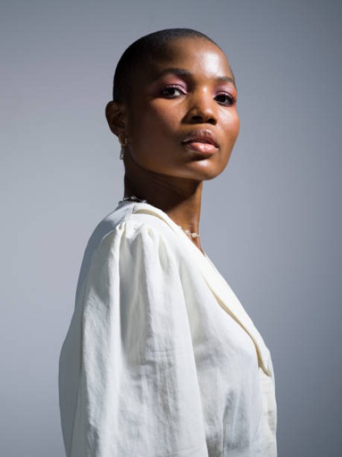 portrait beautiful, confident young woman with shaved head - fashion stock pictures, royalty-free photos & images