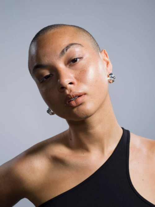 portrait confident, beautiful young woman - fashion stock pictures, royalty-free photos & images