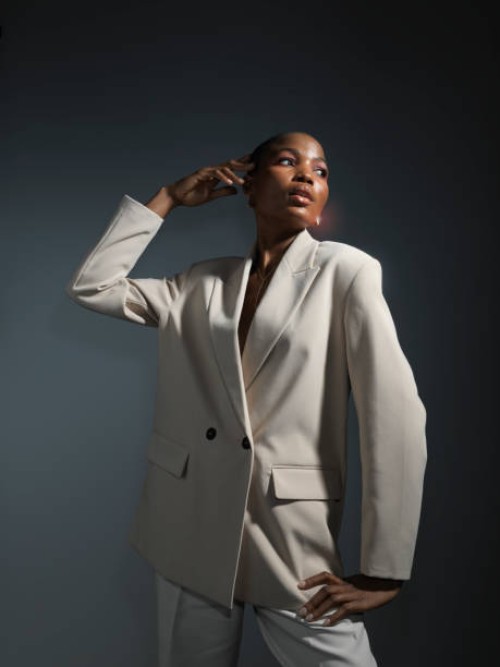 portrait glamorous female fashion model in white blazer - fashion stock pictures, royalty-free photos & images