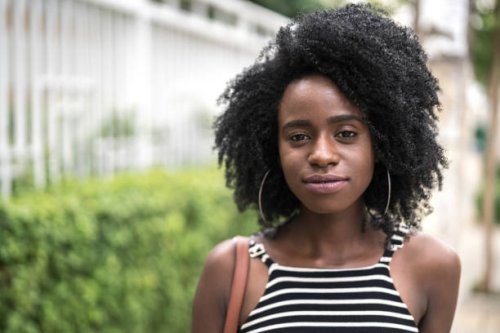 portrait of a beautiful young woman in a city - hairstyle stock pictures, royalty-free photos & images