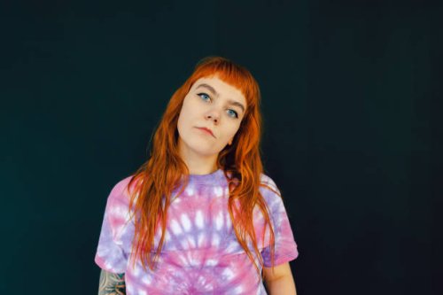 portrait of a cheeky young red-haired woman - hairstyle stock pictures, royalty-free photos & images