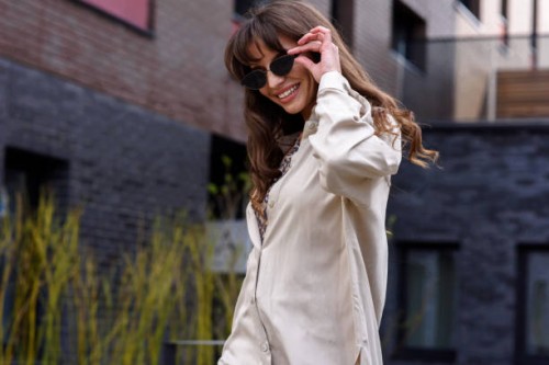 portrait of a fashionable business woman in glamorous sunglasses and trendy clothes on a city street in summer. fashion concept. - fashion stock pictures, royalty-free photos & images