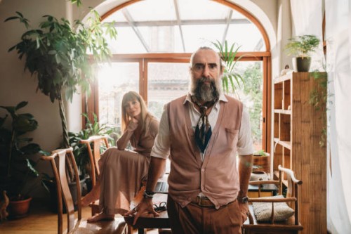 portrait of a mid adult couple in their home office - fashion stock pictures, royalty-free photos & images