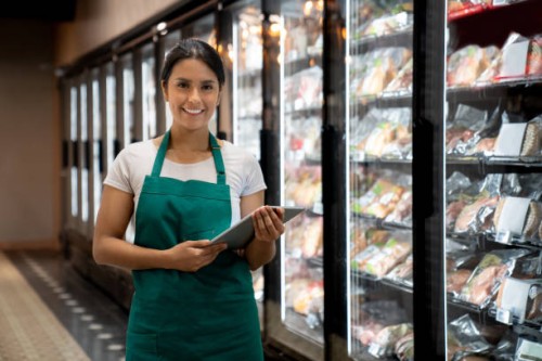 portrait of a retail clerk working at a supermarket - food stock pictures, royalty-free photos & images