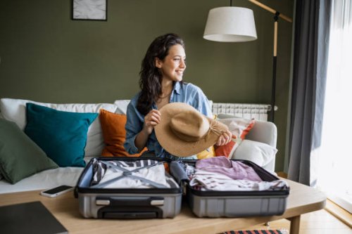 portrait of a woman preparing for a trip - travel stock pictures, royalty-free photos & images