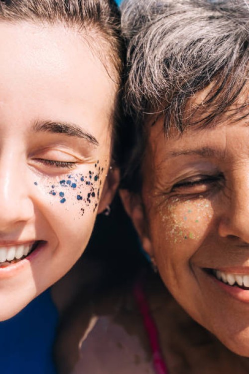 portrait of a woman senior and young resting with glitter on her face on a sunny summer day. close-up, half faces. - fashion stock pictures, royalty-free photos & images