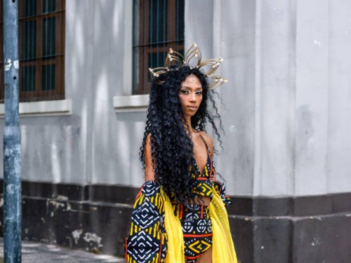 portrait of a young black woman on the street looking at camera - fashion stock pictures, royalty-free photos & images