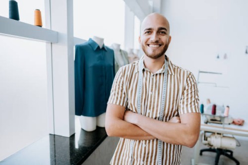 portrait of a young male stylist small company atelie looking at camera - fashion stock pictures, royalty-free photos & images