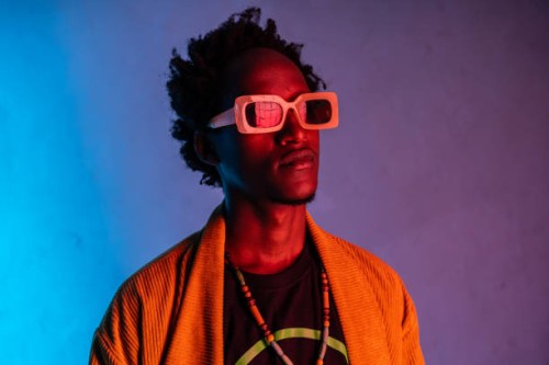 portrait of african-american man in neon ight - fashion stock pictures, royalty-free photos & images