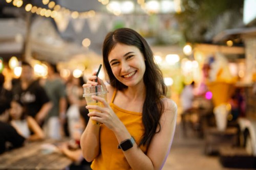 portrait of asian enjoying delicious street food at the street food festival in bangkok. - junk food stock pictures, royalty-free photos & images