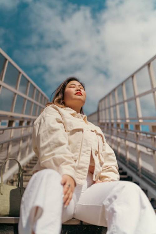 portrait of beautiful body positive woman in city - fashion stock pictures, royalty-free photos & images