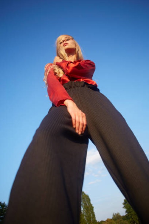 portrait of beautiful young woman dancing in a meadow - fashion stock pictures, royalty-free photos & images