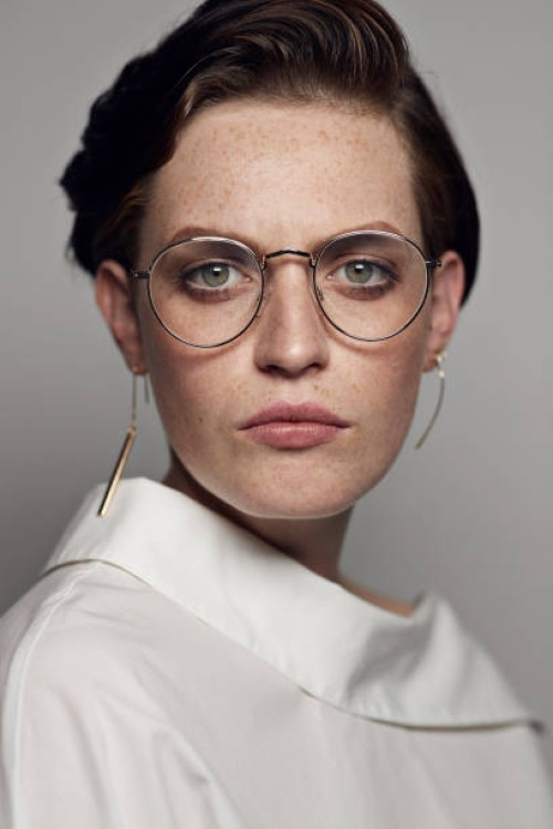 portrait of beautiful young woman wearing glasses & looking in camera - fashion stock pictures, royalty-free photos & images