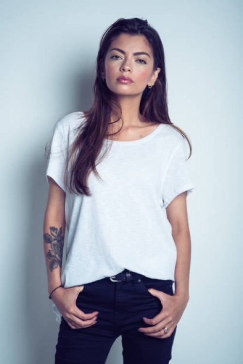 portrait of beautiful young woman wearing white t-shirt - fashion stock pictures, royalty-free photos & images