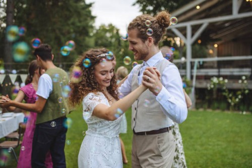 portrait of bride and groom dancing at small garden wedding. - garden decoration stock pictures, royalty-free photos & images