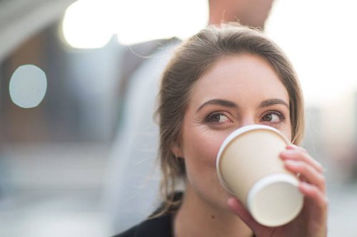 portrait of businesswoman drinking coffee to go - junk food stock pictures, royalty-free photos & images