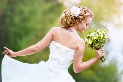 portrait of charming bride with a bouquet - hairstyle stock pictures, royalty-free photos & images