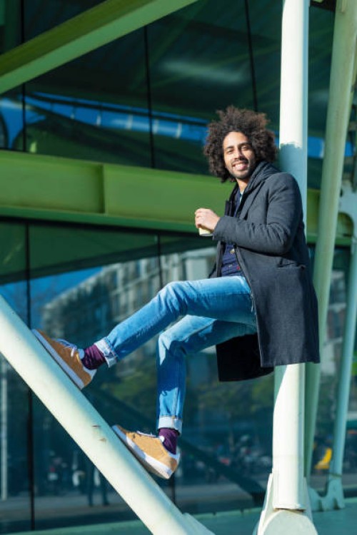 portrait of cheerful handsome man in casual wear posing for the camera bearded young man - junk food stock pictures, royalty-free photos & images