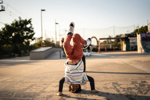 portrait of child boy breakdancing at skateboard park - fashion stock pictures, royalty-free photos & images